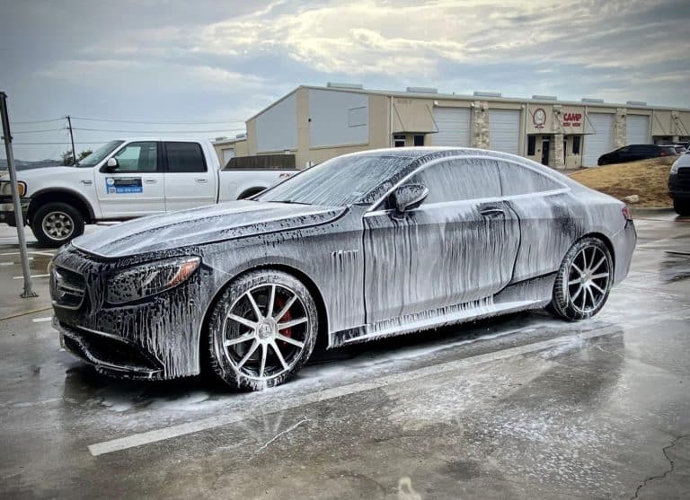 a Mercedes foamed up with soap and water in preparation for a wax