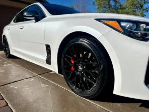 a white Kia sedan after it received an exterior cleaning