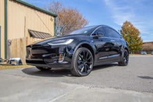 a black Tesla Model 3 after receiving a 10 year ceramic coating on the exterior surfaces