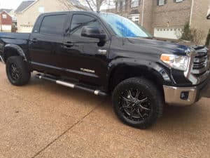 a black Toyota truck after it got polished using our mobile service