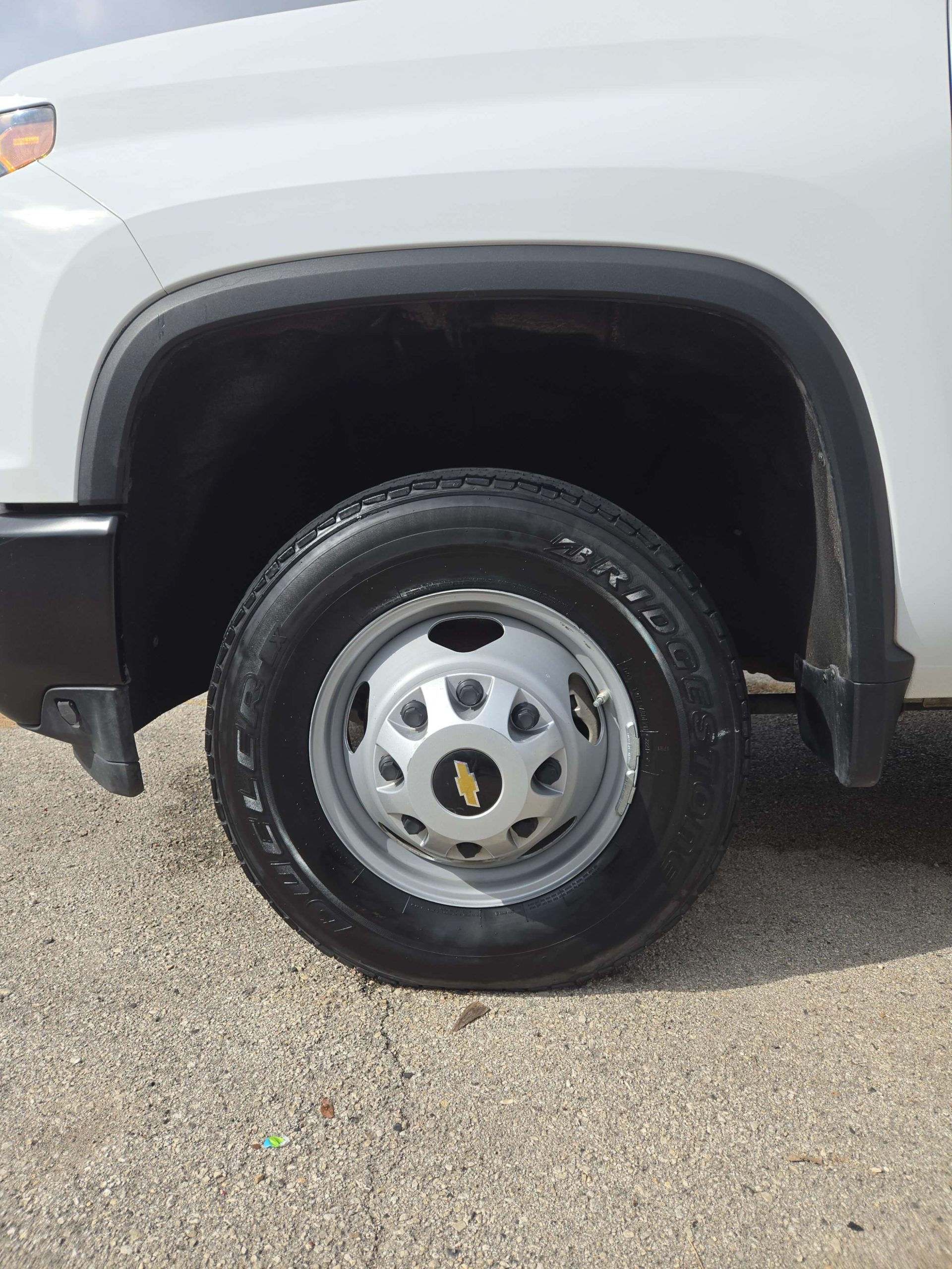 A white truck's wheel after getting detailed and shined