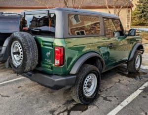 a green ford bronco after receiving our wash and wax package