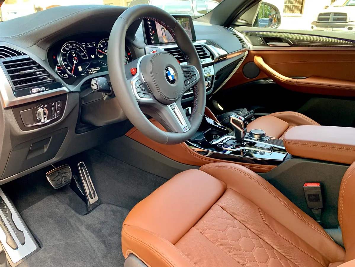 the inside of a clean BMW sedan that receives a maintenance cleaning monthly