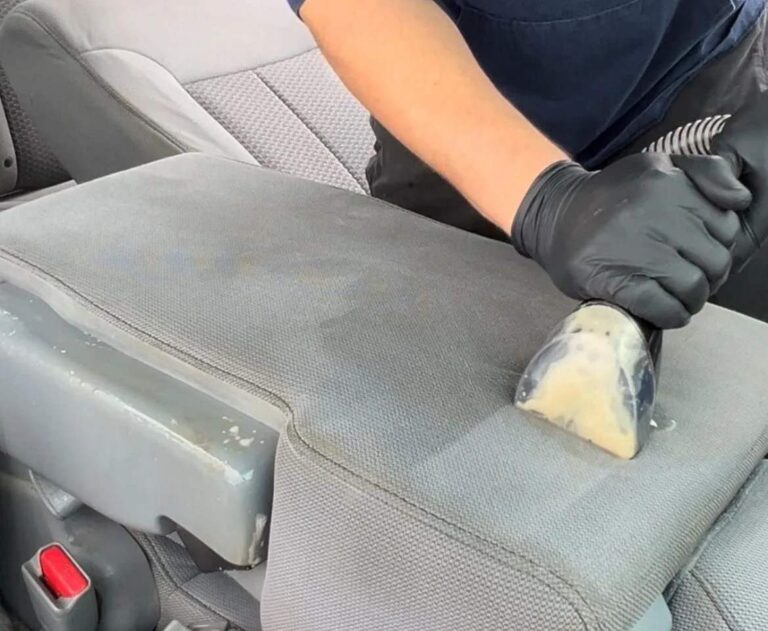 Truck center armrest being cleaned and steam extracted
