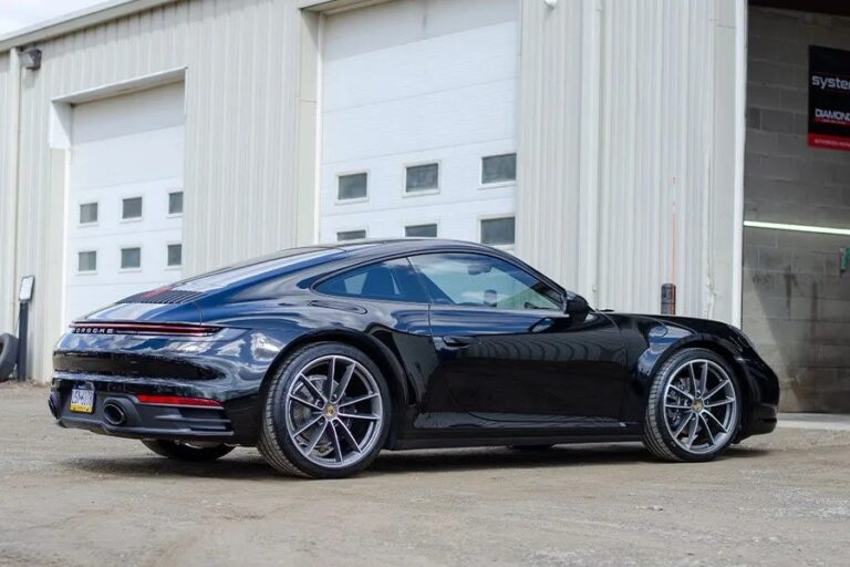 a porsche 911 outside of our new shop TopShine