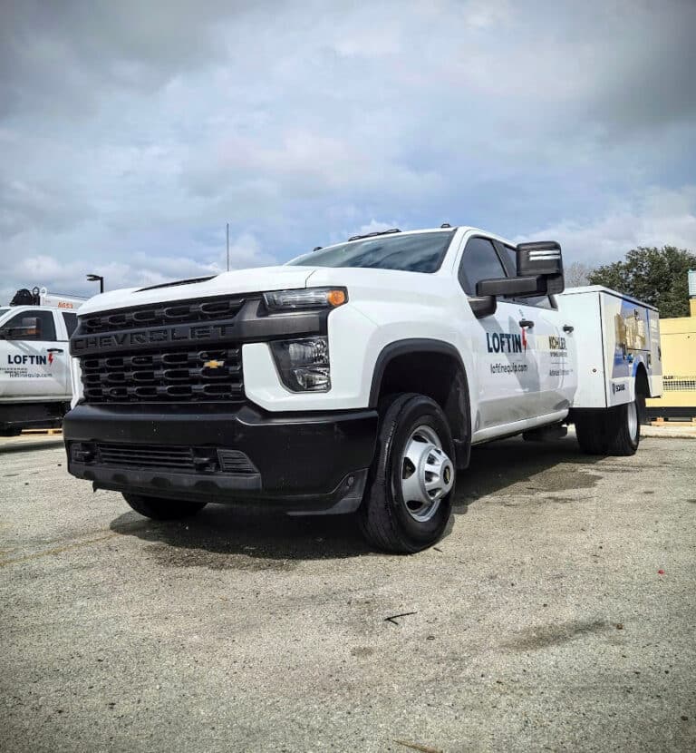 a white chevy fleet truck after receiving a thorough exterior detail