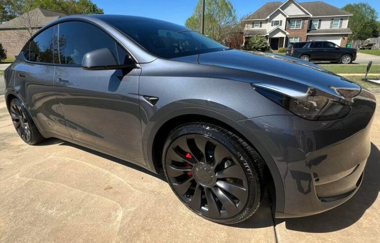 A grey Tesla Model 3 after getting an exterior detail