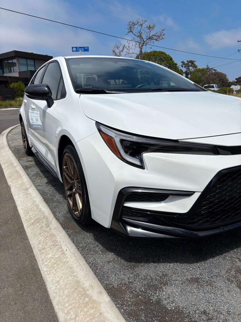 White Toyota Corolla looking clean and shiny after a mobile detailing